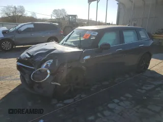 2018 MINI Clubman Cooper S with VIN WMWLN9C57J2E50986, listed as a Copart auction lot 77597404 with 107,606 mi miles and Salvage Title. Bid and sale history available at carsss.com. Image 1.