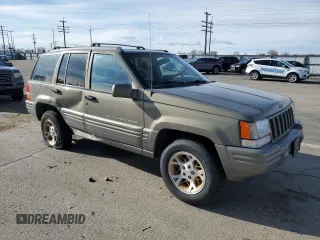 1997 Jeep Grand Cherokee Limited with VIN 1J4GZ78Y4VC754624, listed as a Copart auction lot 49884435 with 144,682 mi miles and Salvage Title. Bid and sale history available at carsss.com. Image 4.