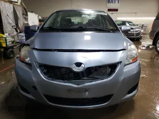 2010 Toyota Yaris with VIN JTDBT4K35A4064446, listed as a Copart auction lot 52099855 with 61,934 mi miles and Salvage Title. Bid and sale history available at carsss.com. Image 5.