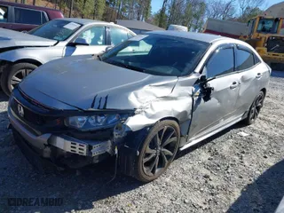 2018 Honda Civic Hatchback Sport with VIN SHHFK7H42JU224960, listed as a IAAI auction lot 41590645 with 121,319 mi miles. Bid and sale history available at carsss.com. Image 2.