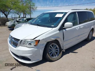 2014 Dodge Grand Caravan SXT with VIN 2C4RDGCG1ER429495, listed as a IAAI auction lot 42058513 with 136,936 mi miles and . Bid and sale history available at DreamBid. Image 2.
