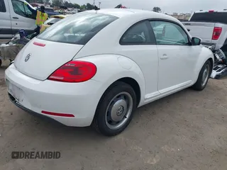 2012 Volkswagen Beetle 2.5L PZEV with VIN 3VWJP7AT9CM611600, listed as a IAAI auction lot 41903289 with 100,577 mi miles. Bid and sale history available at carsss.com. Image 4.
