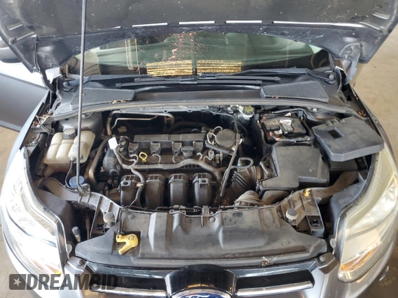 2012 Ford Focus SE with VIN 1FAHP3F28CL114572, listed as a Copart auction lot 63053035 with 142,994 mi miles and Salvage title. Bid and sale history available at DreamBid. Image 11.