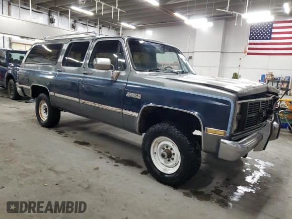 1987 GMC Suburban z VIN 1GKGV26K8HF534817, wystawiony jako Copart lot #43368215 z przebiegiem 82 553 mil mil oraz Tytuł czysty. Historia ofert i sprzedaży dostępna na DreamBid. Obrazek 4.