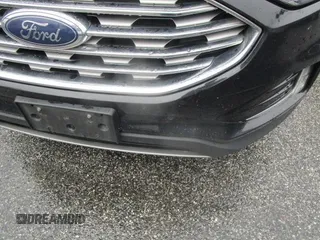 2020 Ford Edge Titanium z VIN 2FMPK3K95LBB37553, wystawiony jako IAAI lot #42407489 z przebiegiem 105 572 mil mil oraz . Historia ofert i sprzedaży dostępna na DreamBid. Obrazek 1.