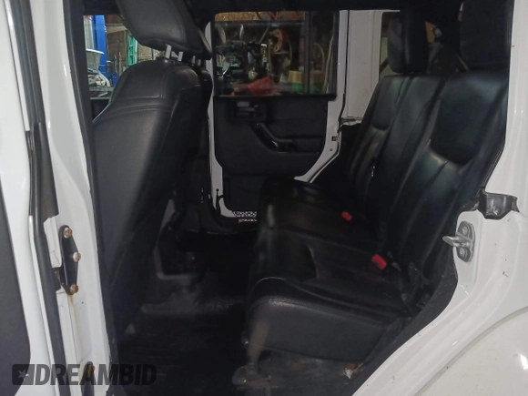 2015 Jeep Wrangler Unlimited Sahara with VIN 1C4BJWEG8FL696581, listed as a IAAI auction lot 41923093 with 193,421 mi miles and . Bid and sale history available at DreamBid. Image 8.