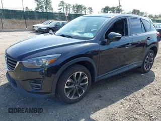 2016 Mazda CX-5 Grand Touring with VIN JM3KE4DY8G0639570, listed as a IAAI auction lot 42098512 with 126,541 mi miles and . Bid and sale history available at carsss.com. Image 2.