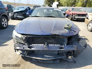 2013 BMW Z4 sDrive35i with VIN WBALM7C57DE385564, listed as a Copart auction lot 60422134 with 56,017 mi miles and Salvage Title. Bid and sale history available at carsss.com. Image 5.