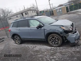 2022 Honda Passport Elite z VIN 5FNYF8H06NB015583, wystawiony jako IAAI lot #41633925 z przebiegiem 49 738 mil mil oraz . Historia ofert i sprzedaży dostępna na DreamBid. Obrazek 13.