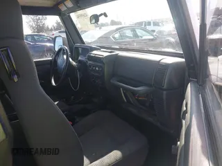 2004 Jeep Wrangler Rubicon with VIN 1J4FA69S94P701660, listed as a IAAI auction lot 41699554 with 74,640 mi miles. Bid and sale history available at carsss.com. Image 5.