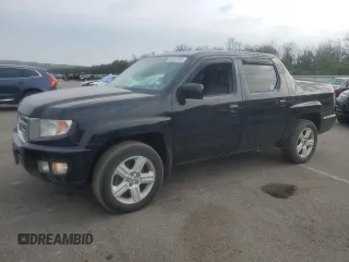 2010 Honda Ridgeline RTL with VIN 5FPYK1F58AB005656, listed as a Copart auction lot 60501765 with 136,240 mi miles and Salvage title. Bid and sale history available at DreamBid. Image 1.