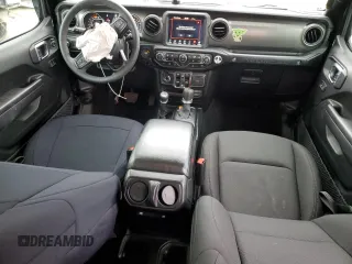 2023 Jeep Wrangler Sport with VIN 1C4HJXDG8PW643414, listed as a Copart auction lot 87768255 with 31,894 mi miles and Salvage Title. Bid and sale history available at DreamBid. Image 8.