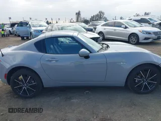 2024 Mazda MX-5 Miata Grand Touring z VIN JM1NDAM76R0602860, wystawiony jako IAAI lot #41346197 z przebiegiem 1 891 mil mil oraz . Historia ofert i sprzedaży dostępna na DreamBid. Obrazek 13.
