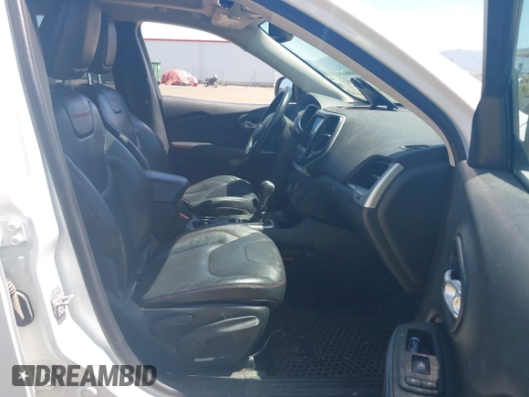 2014 Jeep Cherokee Trailhawk with VIN 1C4PJMBSXEW236807, listed as a IAAI auction lot 42660980 with 157,225 mi miles and . Bid and sale history available at DreamBid. Image 5.