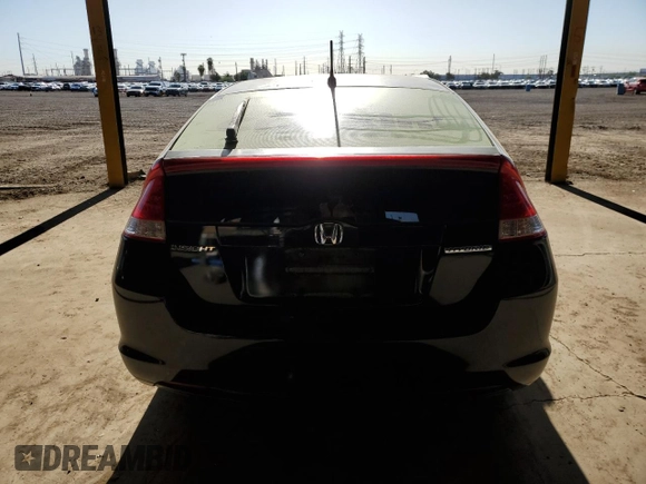 2010 Honda Insight LX z VIN JHMZE2H53AS009865, wystawiony jako Copart lot #52784865 z przebiegiem 349 579 mil mil oraz Czysty tytuł • Clean title. Historia ofert i sprzedaży dostępna na DreamBid. Obrazek 6.