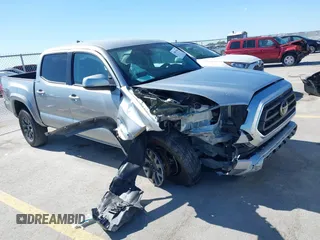 2023 Toyota Tacoma SR with VIN 3TMCZ5AN9PM589986, listed as a IAAI auction lot 39071998 with 31,945 mi miles and . Bid and sale history available at DreamBid. Image 1.