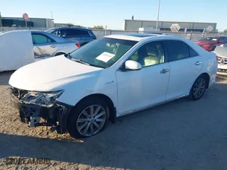 2014 Toyota Camry Hybrid LE with VIN 4T1BD1FK7EU114178, listed as a IAAI auction lot 41833139 with 175,117 mi miles. Bid and sale history available at carsss.com. Image 2.