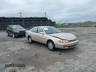 1996 Toyota Camry DX with VIN 4T1BG12K7TU813773, listed as a IAAI auction lot 42084977 with 49,453 mi miles. Bid and sale history available at carsss.com. Image 1.