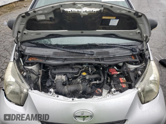 2012 Scion iQ z VIN JTNJJXB08CJ012348, wystawiony jako Copart lot #45415315 z przebiegiem 87 315 mil mil oraz Szkoda całkowita • Salvage title. Historia ofert i sprzedaży dostępna na DreamBid. Obrazek 11.