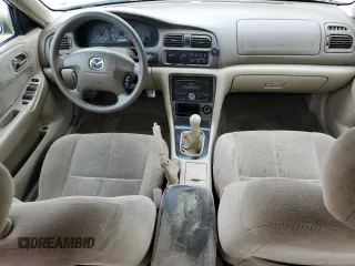 2001 Mazda 626 LX z VIN 1YVGF22C715202574, wystawiony jako Copart lot #54132915 z przebiegiem 237 041 mil mil oraz Szkody całkowita. Historia ofert i sprzedaży dostępna na DreamBid. Obrazek 8.