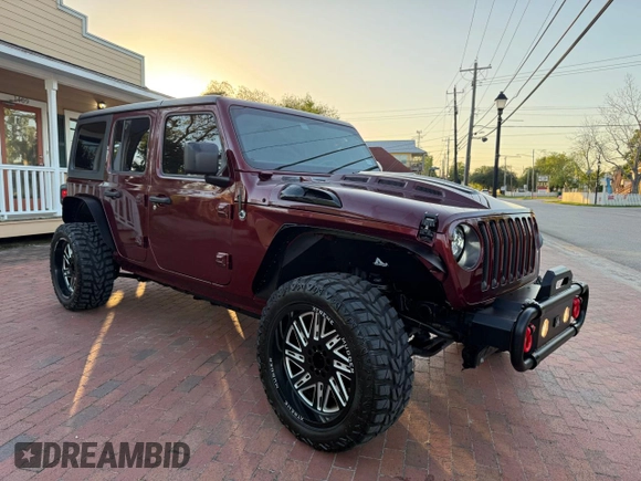 2021 Jeep Wrangler Unlimited Willys with VIN 1C4HJXDNXMW680247, listed as a Copart auction lot 57000145 with 77,407 mi miles and Clean Title. Bid and sale history available at DreamBid. Image 1.
