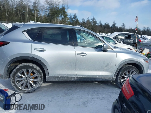 2021 Mazda CX-5 Grand Touring Reserve with VIN JM3KFBAY0M0377030, listed as a IAAI auction lot 41606709 with 39,590 mi miles. Bid and sale history available at carsss.com. Image 13.