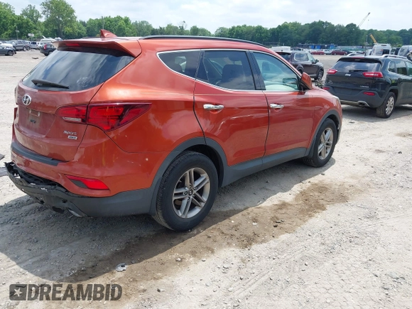 2017 Hyundai Santa Fe 2.4L z VIN 5XYZUDLB1HG463416, wystawiony jako IAAI lot #42546637 z przebiegiem 81 963 mil mil oraz . Historia ofert i sprzedaży dostępna na DreamBid. Obrazek 4.