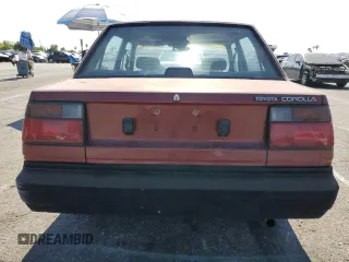 1986 Toyota Corolla with VIN JT2AE82EXG3386120, listed as a Copart auction lot 59397245 with 276,586 mi miles and Salvage title. Bid and sale history available at DreamBid. Image 6.