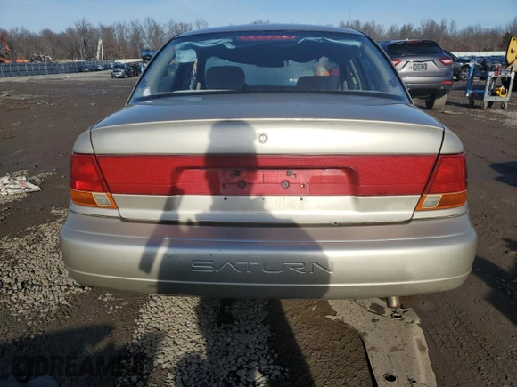 1999 Saturn SL z VIN 1G8ZK5270XZ212874, wystawiony jako Copart lot #85317464 z przebiegiem 153 477 mil mil oraz Szkoda całkowita • Salvage title. Historia ofert i sprzedaży dostępna na DreamBid. Obrazek 6.