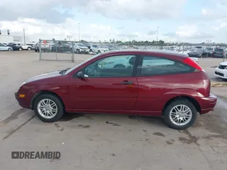 2007 Ford Focus S z VIN 1FAFP31N27W231884, wystawiony jako IAAI lot #41138534 z przebiegiem 84 506 mil mil oraz . Historia ofert i sprzedaży dostępna na DreamBid. Obrazek 15.