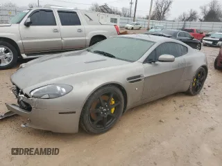 2006 Aston Martin Vantage z VIN SCFBB03BX6GC02042, wystawiony jako Copart lot #42527075 z przebiegiem 61 538 mil mil oraz Szkody całkowita. Historia ofert i sprzedaży dostępna na DreamBid. Obrazek 1.