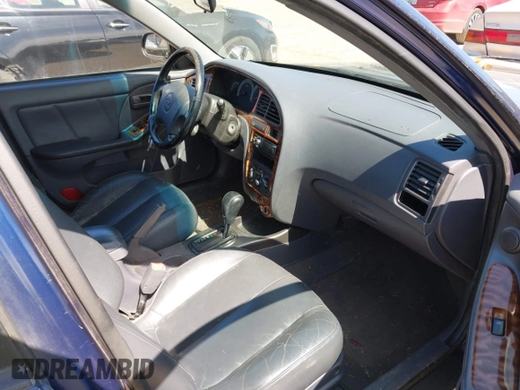 2003 Hyundai Elantra GLS z VIN KMHDN45D93U648323, wystawiony jako IAAI lot #42023382 z przebiegiem 213 540 mil mil oraz . Historia ofert i sprzedaży dostępna na DreamBid. Obrazek 5.