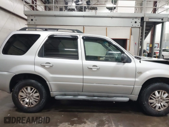 2007 Mercury Mariner Premier z VIN 4M2CU97197KJ06878, wystawiony jako IAAI lot #41033843 z przebiegiem 139 492 mil mil oraz . Historia ofert i sprzedaży dostępna na DreamBid. Obrazek 13.