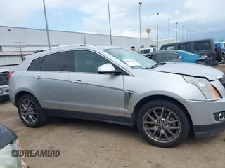 2015 Cadillac SRX Performance Collection z VIN 3GYFNCE36FS633386, wystawiony jako IAAI lot #41851338 z przebiegiem 102 586 mil mil oraz . Historia ofert i sprzedaży dostępna na DreamBid. Obrazek 13.