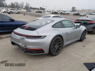 2023 Porsche 911 Carrera with VIN WP0AA2A93PS206048, listed as a IAAI auction lot 42022225 with 6,439 mi miles and . Bid and sale history available at DreamBid. Image 4.