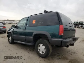 1998 Chevrolet Tahoe z VIN 3GNEK18R4WG128424, wystawiony jako Copart lot #79684984 z przebiegiem 217 456 mil mil oraz Szkoda całkowita • Salvage title. Historia ofert i sprzedaży dostępna na DreamBid. Obrazek 2.