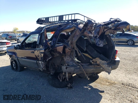 1997 Jeep Grand Cherokee Laredo with VIN 1J4GZ58Y3VC653093, listed as a Copart auction lot 79576964 with 0 mi miles and Salvage Title. Bid and sale history available at carsss.com. Image 2.