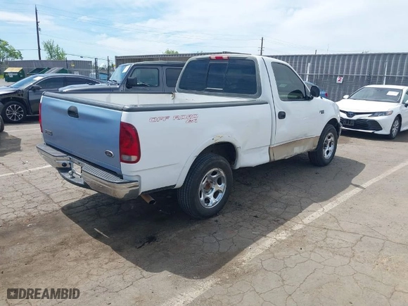 1999 Ford F-150 Work Series with VIN 2FTZF1729XCA83871, listed as a IAAI auction lot 42009506 with 234,988 mi miles. Bid and sale history available at carsss.com. Image 4.