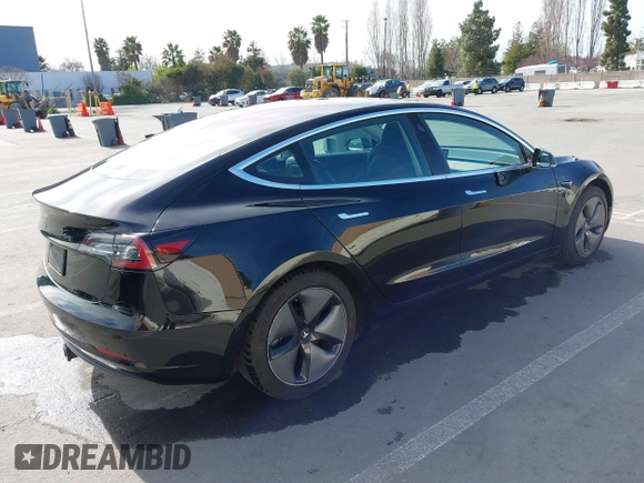 2019 Tesla Model 3 Mid Range with VIN 5YJ3E1EA2KF305834, listed as a IAAI auction lot 41719610 with 126,333 mi miles and . Bid and sale history available at DreamBid. Image 4.