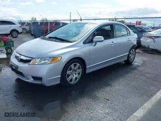 2011 Honda Civic Sdn LX with VIN 2HGFA1F59BH304380, listed as a IAAI auction lot 41936278 with 223,973 mi miles. Bid and sale history available at carsss.com. Image 2.