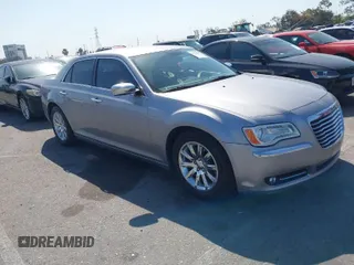 2013 Chrysler 300 with VIN 2C3CCAET7DH650544, listed as a IAAI auction lot 41972907 with 121,474 mi miles. Bid and sale history available at carsss.com. Image 1.