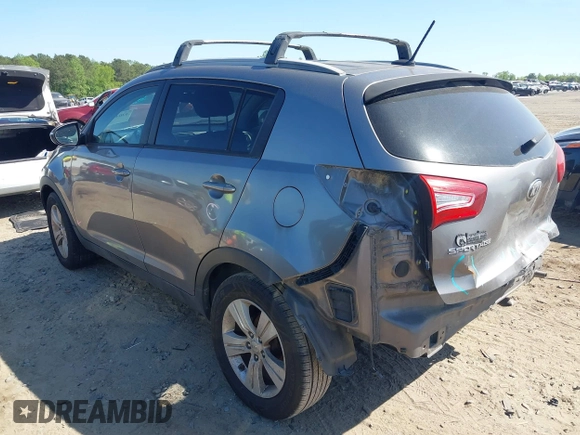 2013 Kia Sportage LX with VIN KNDPB3A21D7486860, listed as a IAAI auction lot 42049450 with 177,059 mi miles and . Bid and sale history available at DreamBid. Image 3.