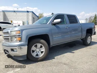 2015 Chevrolet Silverado 1500 LT with VIN 3GCPCREC1FG445638, listed as a Copart auction lot 55586395 with 106,317 mi miles and Salvage Title. Bid and sale history available at DreamBid. Image 1.