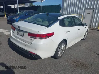 2016 Kia Optima EX with VIN 5XXGU4L32GG070138, listed as a IAAI auction lot 42138810 with 131,040 mi miles. Bid and sale history available at carsss.com. Image 4.