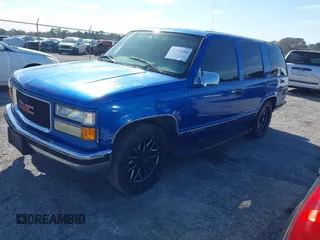 1997 GMC Yukon with VIN 1GKEC13R0VJ744958, listed as a IAAI auction lot 41474196 with 257,847 mi miles. Bid and sale history available at carsss.com. Image 2.