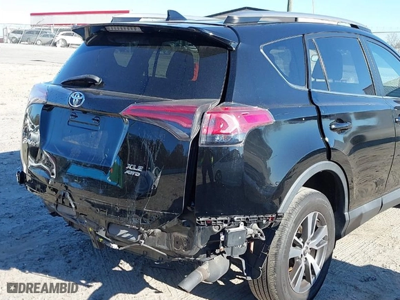 2018 Toyota RAV4 XLE with VIN 2T3RFREV9JW793956, listed as a IAAI auction lot 41012152 with 77,033 mi miles. Bid and sale history available at carsss.com. Image 6.
