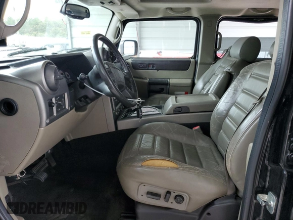 2003 Hummer H2 with VIN 5GRGN23U33H118459, listed as a Copart auction lot 77765694 with 157,390 mi miles and Salvage Title. Bid and sale history available at carsss.com. Image 7.