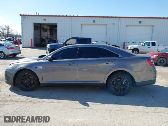2013 Ford Taurus SEL z VIN 1FAHP2H83DG231000, wystawiony jako IAAI lot #41986420 z przebiegiem 200 390 mil mil oraz . Historia ofert i sprzedaży dostępna na DreamBid. Obrazek 14.