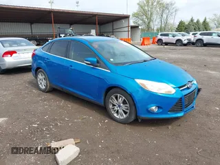 2012 Ford Focus SEL with VIN 1FAHP3H2XCL162636, listed as a IAAI auction lot 42102279 with 100,643 mi miles. Bid and sale history available at carsss.com. Image 1.