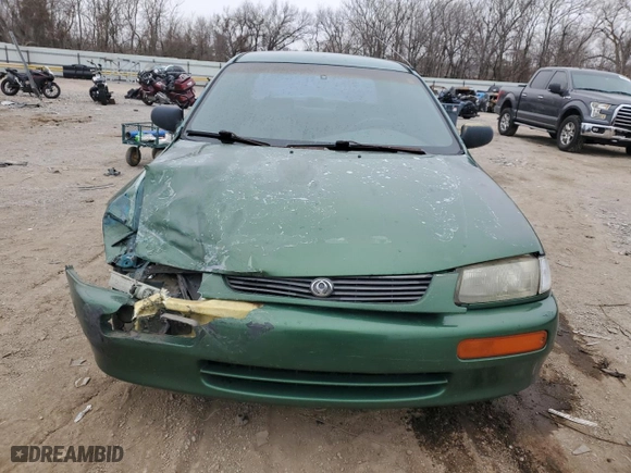 1996 Mazda Protege DX with VIN JM1BB1418T0330159, listed as a Copart auction lot 43815085 with 231,618 mi miles and Salvage Title. Bid and sale history available at carsss.com. Image 5.